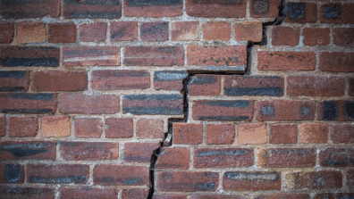 crack in a red brick wall due to subsidence